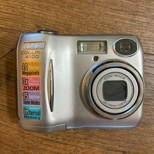 Nikon digital camera. Good shape. Bag slightly stained.